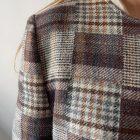 Imagen de Detalles tejido chaqueta asimetrica cuadros