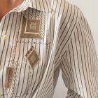 Imagen de Detalles tejido camisa bordada a rayas